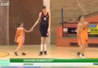 A 13 year old basketball player is the talles