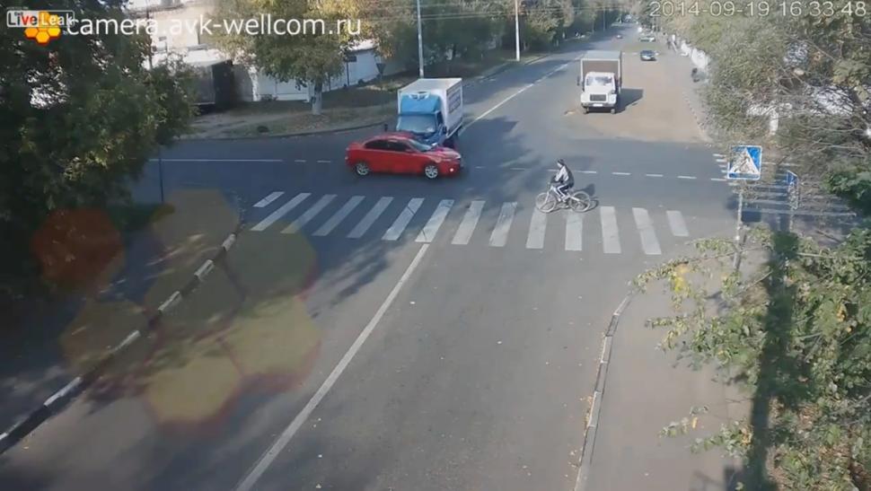 cyclist-in-moscow-miraculously-escapes-when-he-is-caught-in-car-smash