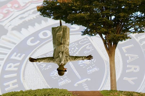 police-receive-report-man-hanging-upside-tree