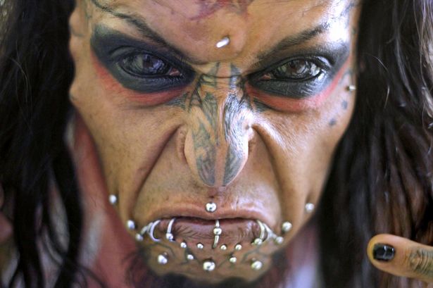 terrifying-devil-man-is-with-black-tattooed-eyeballs-and-implanted-horns
