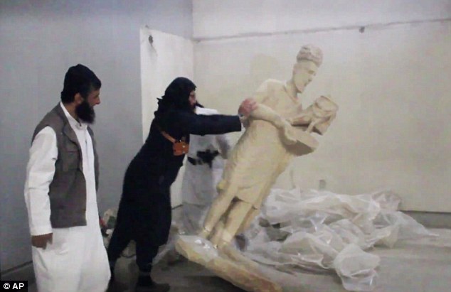 ISIS militants destroy ancient Iraq statues i