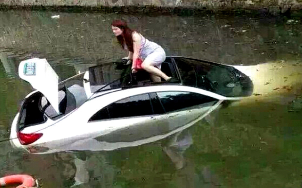Lady driver plunges Mercedes-Benz into a rive