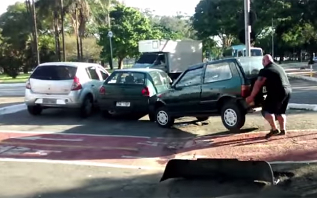 angry-cyclist-lifts-car-out-of-the-bike-lane