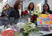 Bangkok residents post messages at bomb hit s