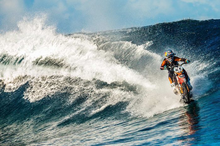 an-australian-daredevil-rides-his-motorbike-over-waves