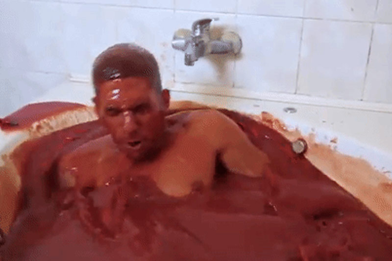 man-bathes-spicy-sauce